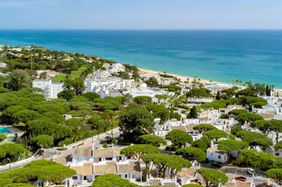 an aerial view of a town with trees and the ocean at Casa Alessa - Vale de Lobo in Almancil