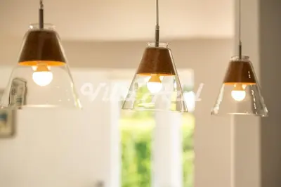 a group of three lights hanging from a ceiling at Elegant villa with private pool in Quarteira in Vilamoura