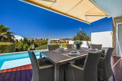 a hot tub sitting on top of a balcony at ELLE Design Villa by OCvillas - Private Heated Pool and Jacuzzi in Albufeira