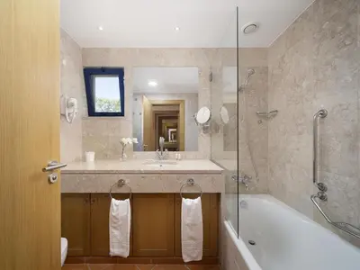 a bathroom with a sink and a tub and a shower at AL - Apartamento Vila Sol F5 L in Vilamoura