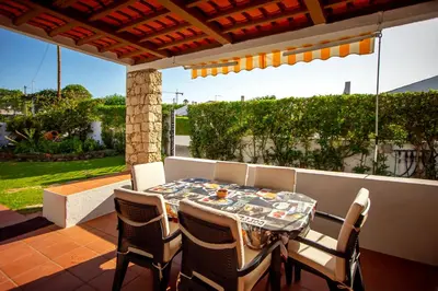 a table and chairs sitting on a patio at LOTUS VILLA 2, ALBUFEIRA in Albufeira