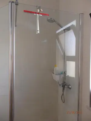 a shower with a glass door in a bathroom at Casa do Algarve in Albufeira