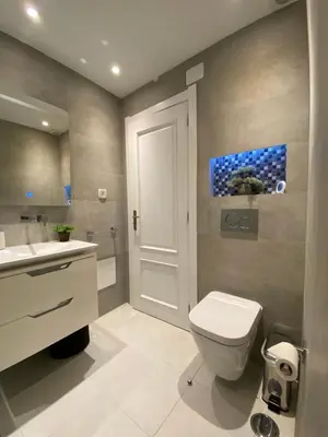 a bathroom with a toilet and a sink at RS Apartamento in Quarteira