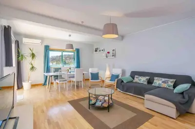 a living room with a couch and a table at Admirable 1 bedroom Marina view apt. Albufeira in Albufeira