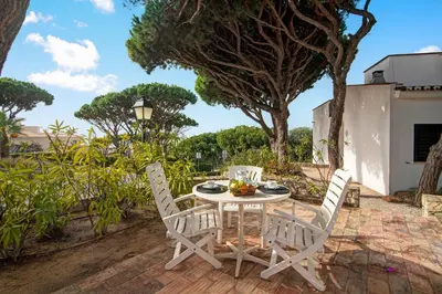 a white table with a basket of fruit on it at Villa Apple in Vale do Lobo