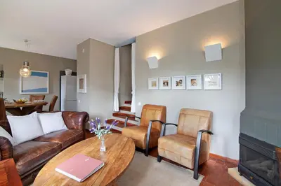 a living room with a couch and a table at Villa Apfel in Vale do Lobo