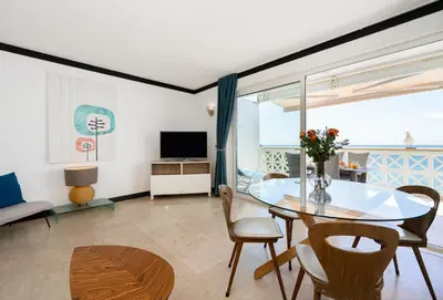 a dining room with a glass table and chairs at Aveiros by the Sea by Intiholidays in Albufeira