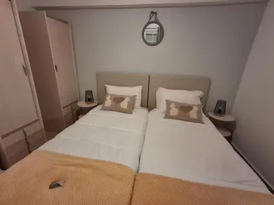 two beds in a small room with two pillows at Villa Sunshine in Albufeira