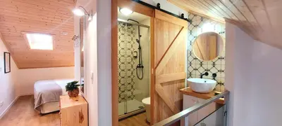 a small bathroom with a sink and a shower at 7 Styles Apartments by Raspberry Cascade in Faro
