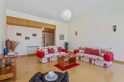 a bedroom with a bed with blue pillows at Villa Marina Azul by Villa Plus in Albufeira