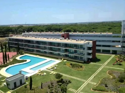 a large building with a swimming pool and a resort at Residence Golf Club-Vilamoura-Algarve in Vilamoura
