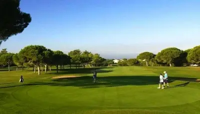 a group of people playing golf on a golf course at Residence Golf Club-Vilamoura-Algarve in Vilamoura