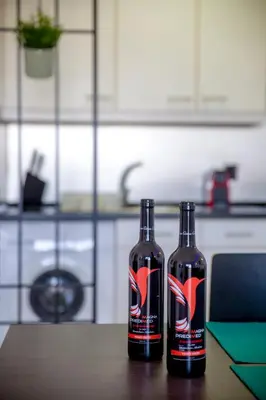 two bottles sitting on a table in a kitchen at Sea View Apartment - 3 Swimming Pool & Fitness in Albufeira