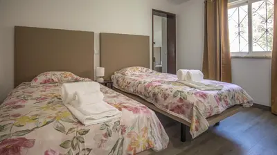 a room with two beds and a mirror at Villa Pedro - Swimming Pool - BY BEDZY in Albufeira