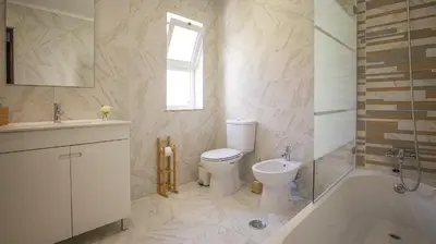 a bathroom with a toilet and a tub and a sink at Villa Pedro - Swimming Pool - BY BEDZY in Albufeira