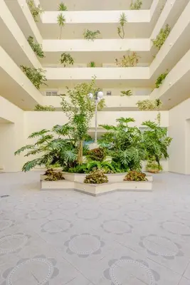 a room filled with plants and a ceiling at Casa Europa in Vilamoura