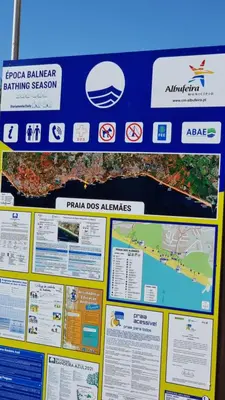 a sign on a wall with a map at Casa da Praia by Sunny Deluxe in Albufeira