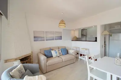 a living room with a couch and a table at Apt 1 Quarto, Piscina, AC, Varanda, Prestige For Home in Vilamoura