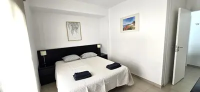 a bedroom with a bed with two bags on it at Historic Centre B - Albufeira in Albufeira