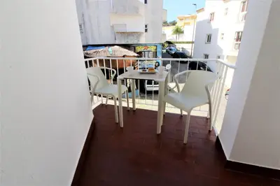 a balcony with a table and chairs on it at Historic Centre B - Albufeira in Albufeira