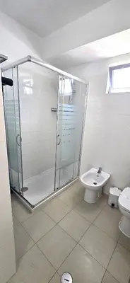 a bathroom with a shower and a toilet and a sink at Historic Centre B - Albufeira in Albufeira
