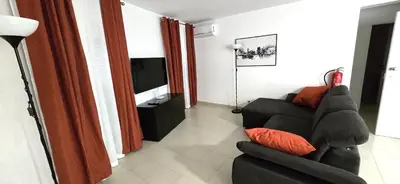 a kitchen with a table and chairs in a room at Historic Centre C - Albufeira in Albufeira