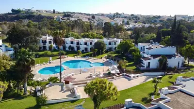 an aerial view of a villa with a swimming pool at Apartamento Surpresa in Albufeira