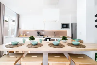 a kitchen with a table with blue bowls on it at Bambu Villa in Albufeira