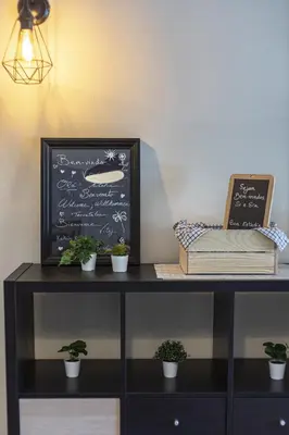 a table with plants and a chalkboard on it at Real Alegria - Terrace with pool - Vilamoura in Vilamoura