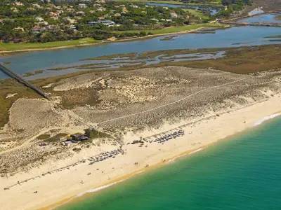 an aerial view of a beach and the ocean at Quinta do Lago - Beach,Ténis, Bikes in Quinta do Lago