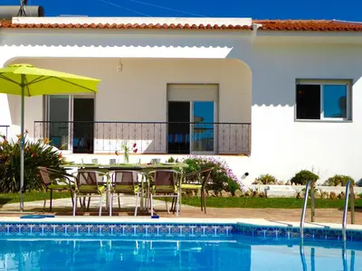a swimming pool in the backyard of a house at Vital by Check-in Portugal in Albufeira