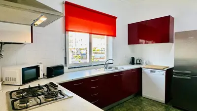 a bedroom with two beds and a large window at Vital by Check-in Portugal in Albufeira
