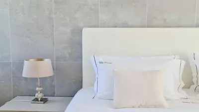a white bed with a white pillow and a lamp at Villa Terese-CleverDetails, Central Vilamoura, Sleeps 6, luxury, walking distance in Vilamoura