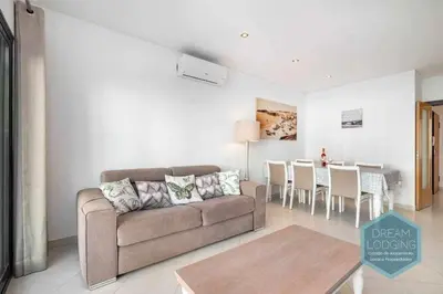 a living room with a couch and a table at Terrace Miguel Torga - Dream Lodging in Albufeira