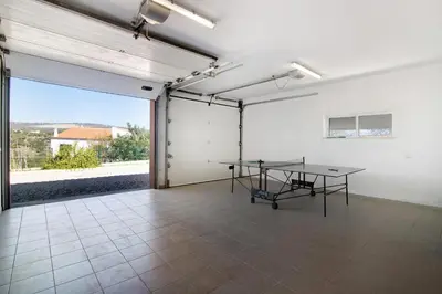 a room with a table in the middle of it at Casa Tulipas in Loulé