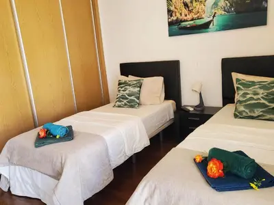 a room with two beds with towels on them at Villa beautiful View over the sea - T in Albufeira