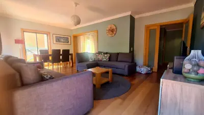 a living room with a couch and a table at 2 Terrace Town House in Albufeira
