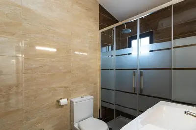 a bathroom with a toilet and a sink at The Albufeira Concierge - Villa Balaia Sun Terrace in Albufeira