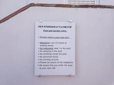 a sign on the side of a building at Old Fisherman's Corner 18 - Centro Old Town Albufeira in Albufeira
