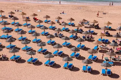 an overhead view of a beach with chairs and umbrellas at Old Fisherman's Corner 18 - Centro Old Town Albufeira in Albufeira