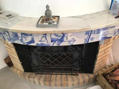 a stone table with a statue on top of it at Charming House with Pool in Faro in Faro