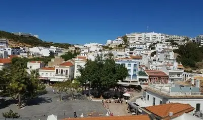a city with a bunch of white buildings at Sun Apartment on the Beach in Albufeira