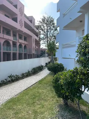 a row of cars parked in front of a building at Velamar Praia 411 - 300m da praia in Albufeira