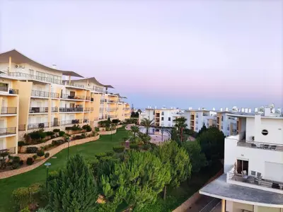 a table and chairs on a balcony with a view at AlbufeiraOrada SunSet Penthouse by Be Cherish in Albufeira