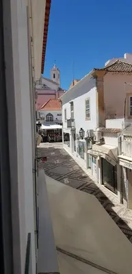 a view from a window of a street with buildings at Terrace apartament on the Sea in Albufeira