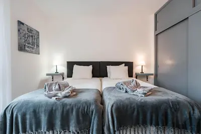 a living room with a couch and a table at Apartamentos Julieta in Albufeira