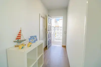 a bedroom with a bed with the words home hollidays at #035 T2 Oura Village by Home Holidays in Albufeira