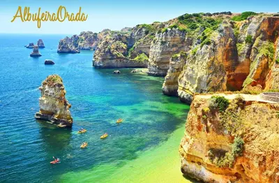a group of people on a beach near the ocean at AlbufeiraOrada BlueSky by Be Cherish in Albufeira