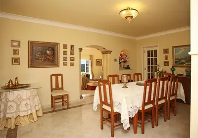 a dining room with a table and chairs at Villa Jumar in Albufeira