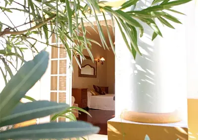 a room with a white column and a bed at Villa Jumar in Albufeira